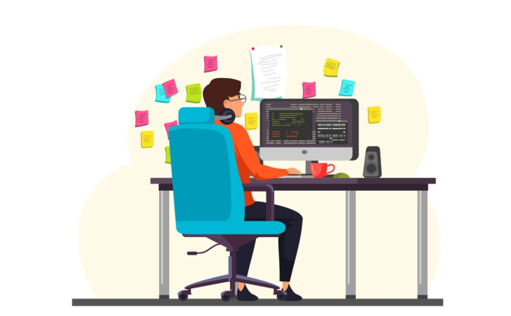 A coder is working at a desk surrounded by sticky notes
