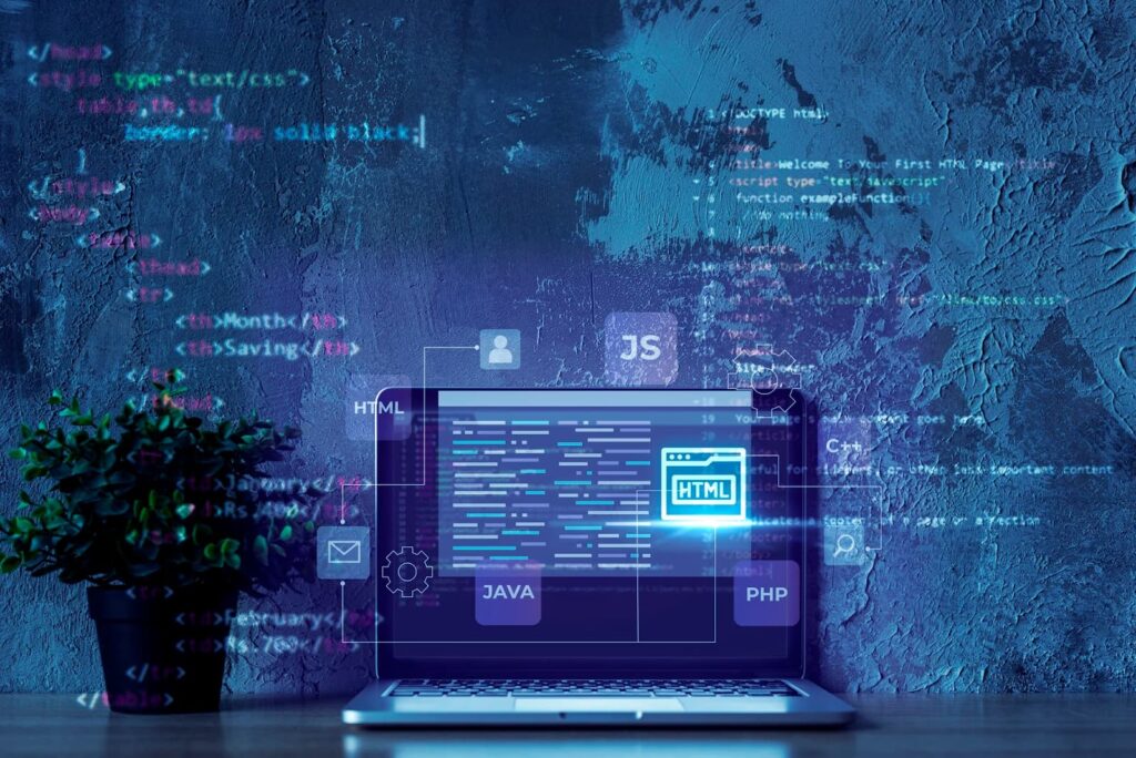Laptop on wall background with software code