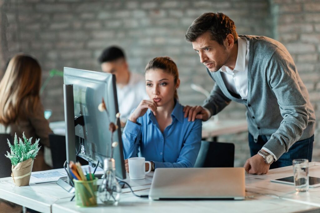 Man and woman work together on work project